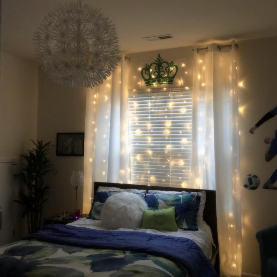 Twinkle Lights Behind a reviewer&#x27;s Bed