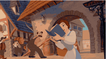 Belle spinning and singing while holding a book