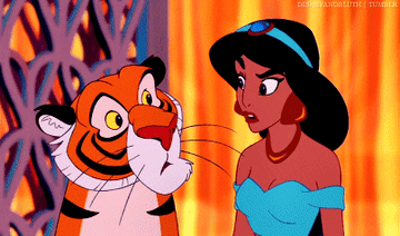 Jasmine and Rajah looking at each other suspiciously
