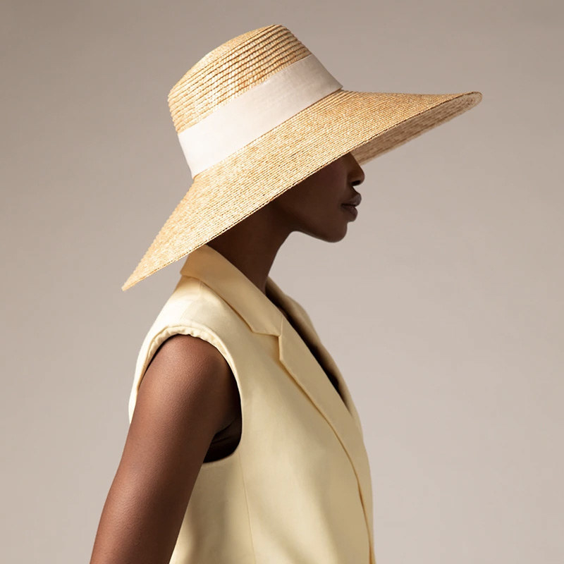 A person wearing a large sun hat