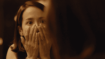 Woman covering face in shock