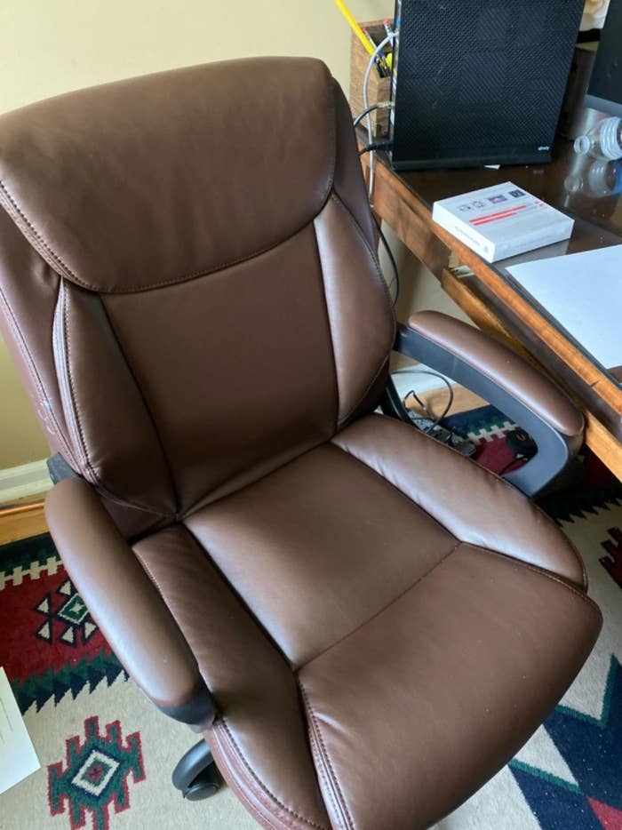 The computer desk chair in brown leather
