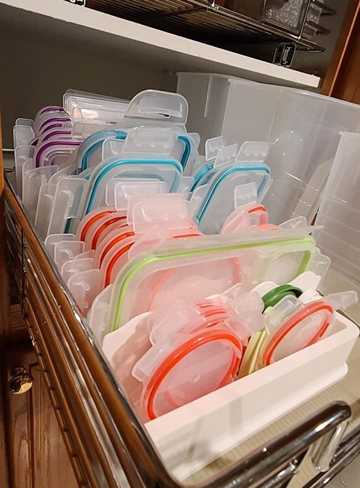 Reviewer&#x27;s photo of the lid storage organizer in action