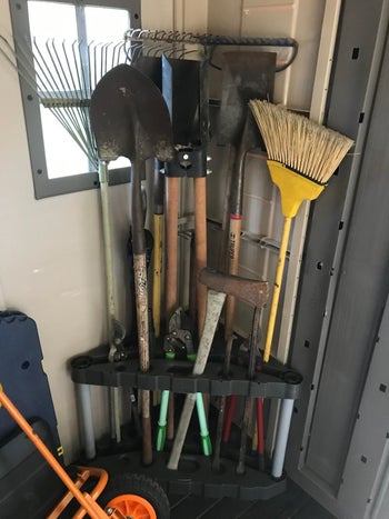 a triangle storage unit for rakes and shovels
