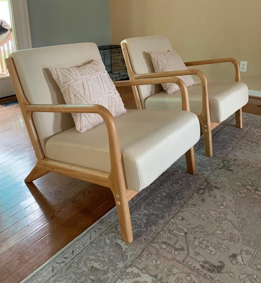 The mid-century modern accent chair in beige with a wood base