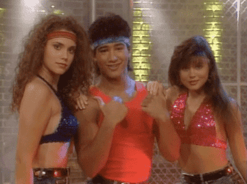 Jessie, Slater, and Kelly from Saved By The Bell in workoutout gear