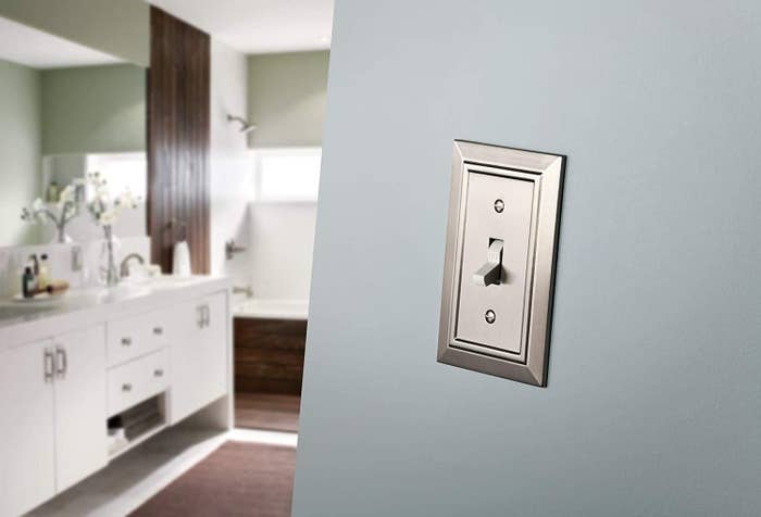 A shiny new light switch panel on a wall