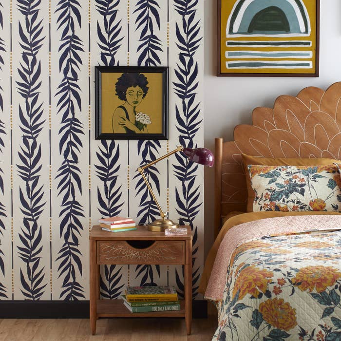 Blue and yellow fern wallpaper in bedroom