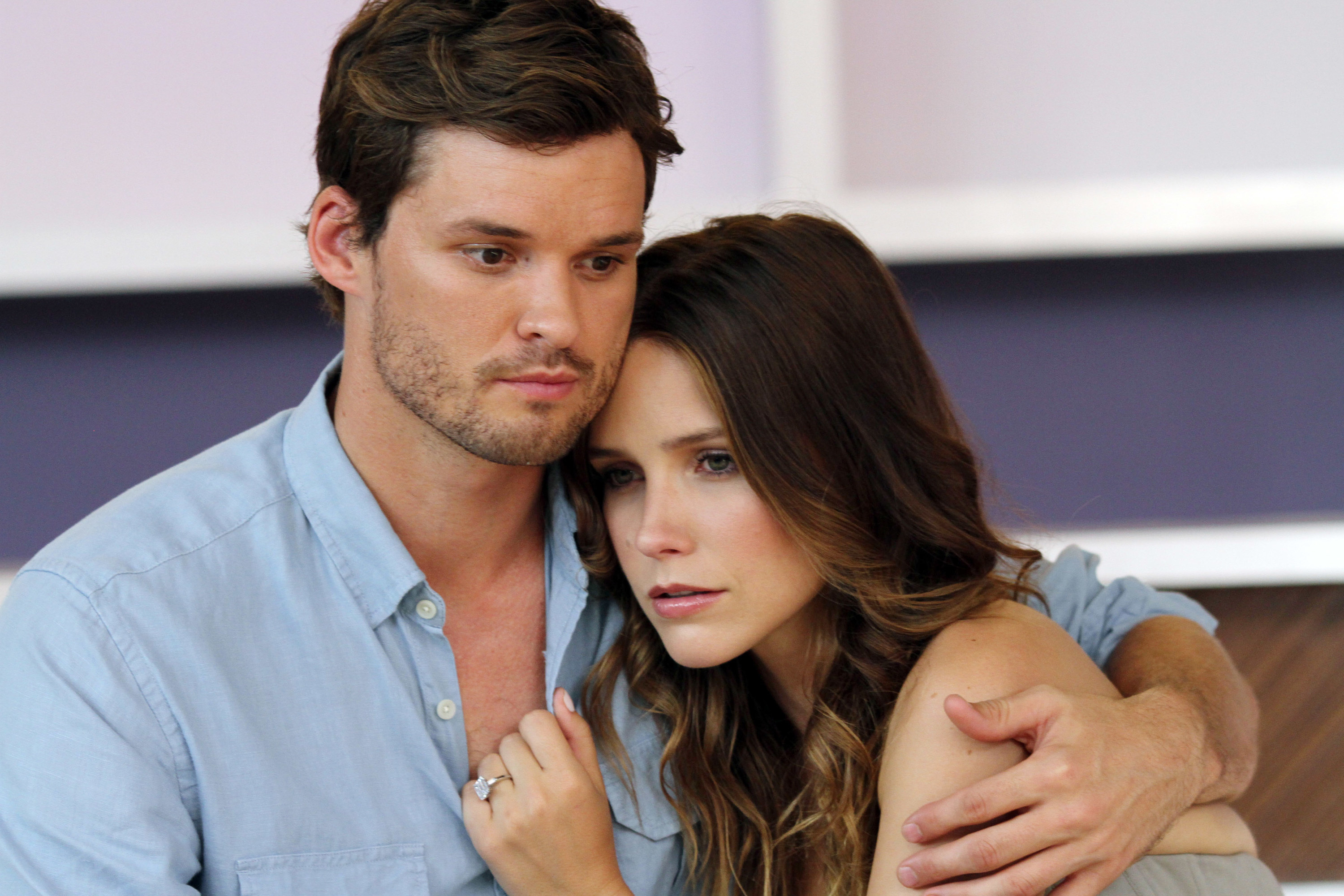 On the set of One Tree Hill, actor Austin Nichols holds a concerned-looking Sophia Bush