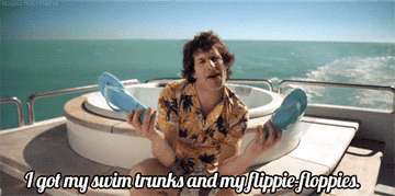 Gif of Andy Samberg in the &quot;I&#x27;m On A Boat&quot; video saying &quot;I got my swim trunks and my flippie-floppies&quot;