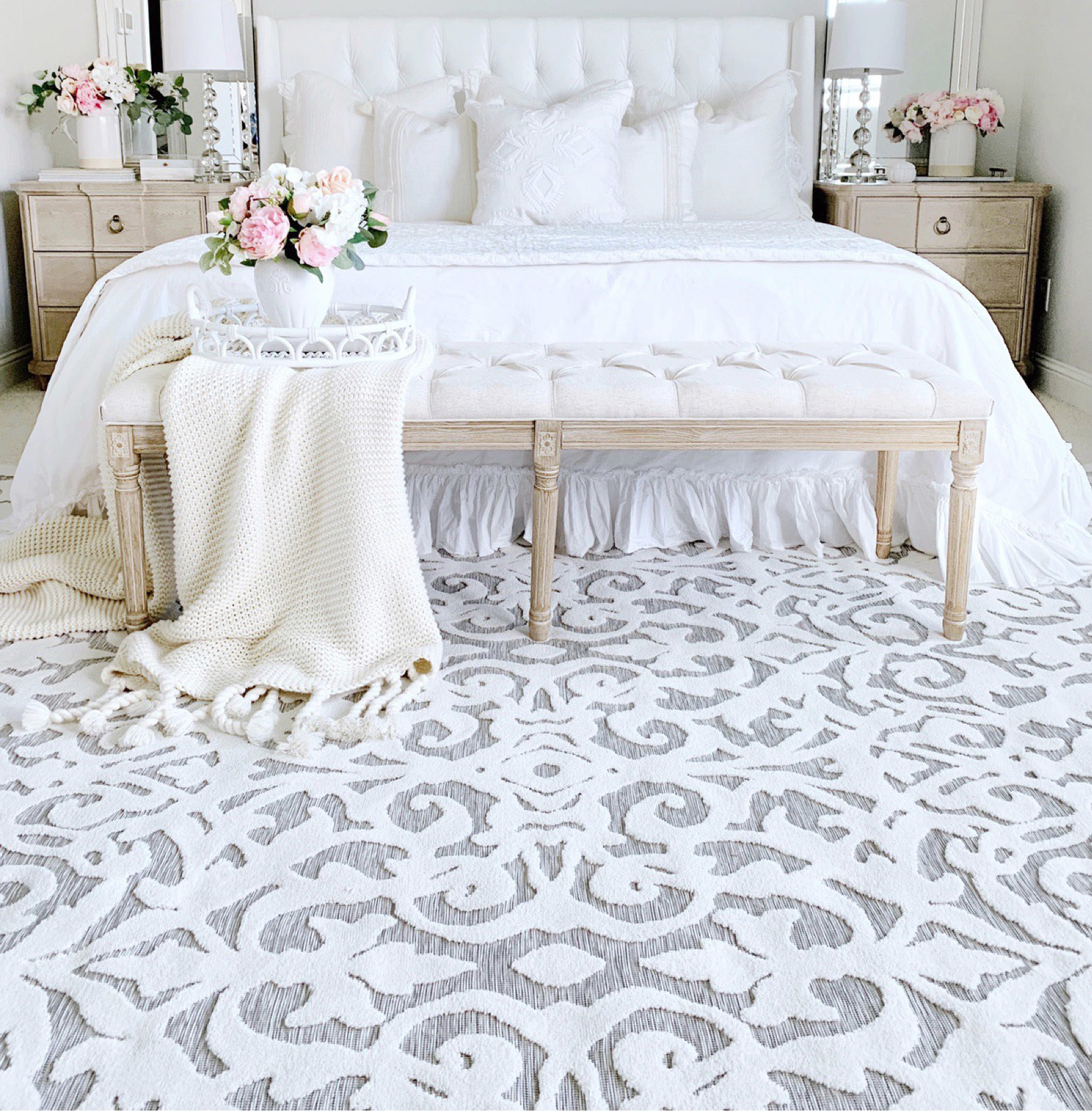 A white pattern carpet in a white bedroom