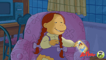 Muffy from Arthur taking a selfie while sitting in a chair