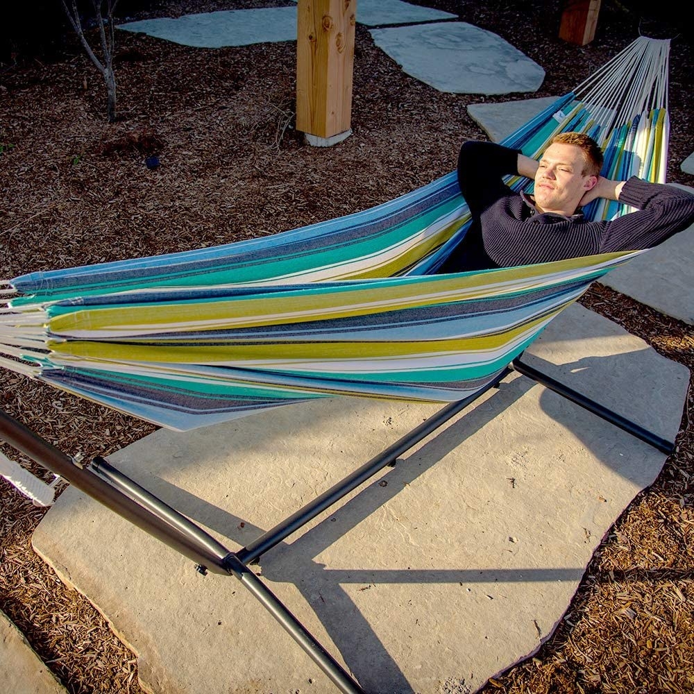 person lying in a hammock