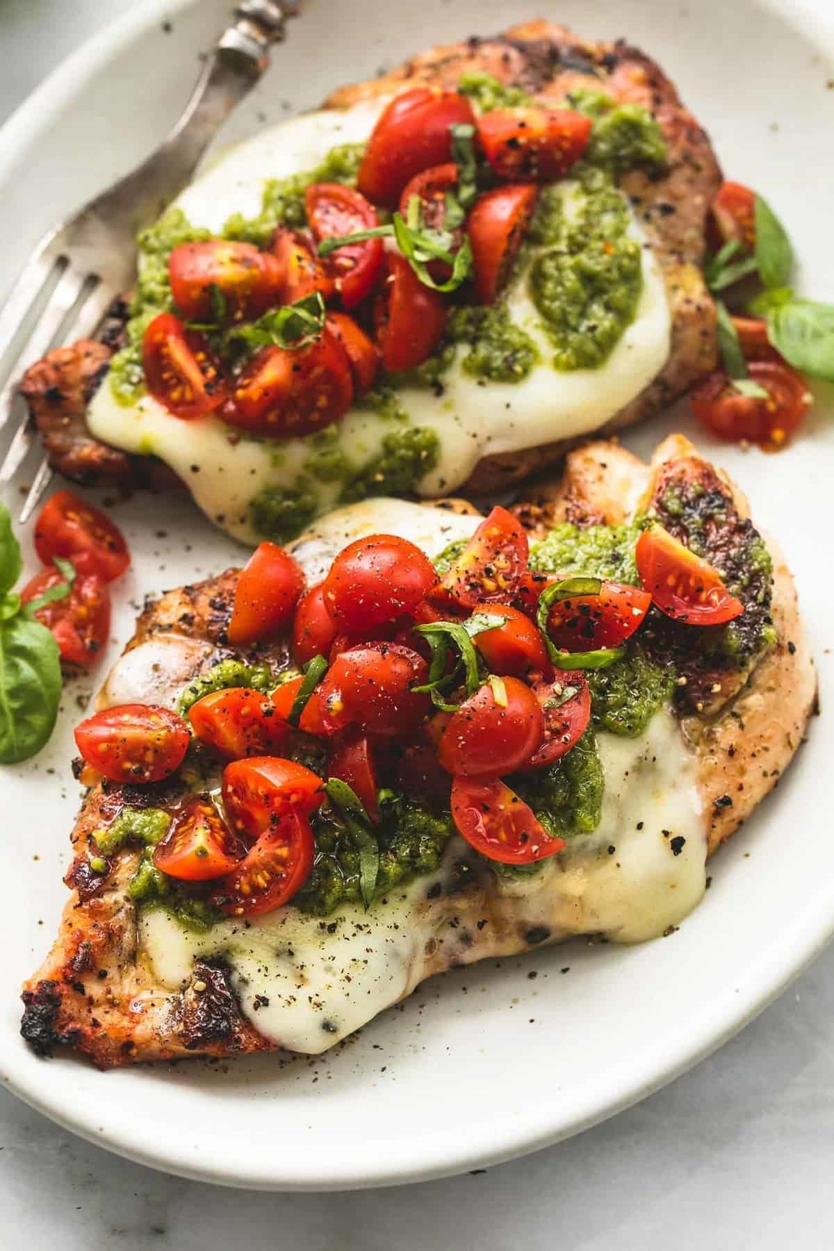 Grilled chicken with mozarella, tomatoes, and pesto.