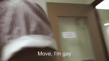 man walking forward and saying &quot;move I&#x27;m gay&quot; then pushing another person&#x27;s papers off the copy machine