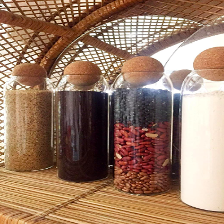Larger canisters on wicker pantry shelf 