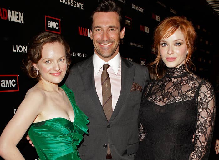 Christina stands with co-stars Jon Hamm and Elizabeth Moss