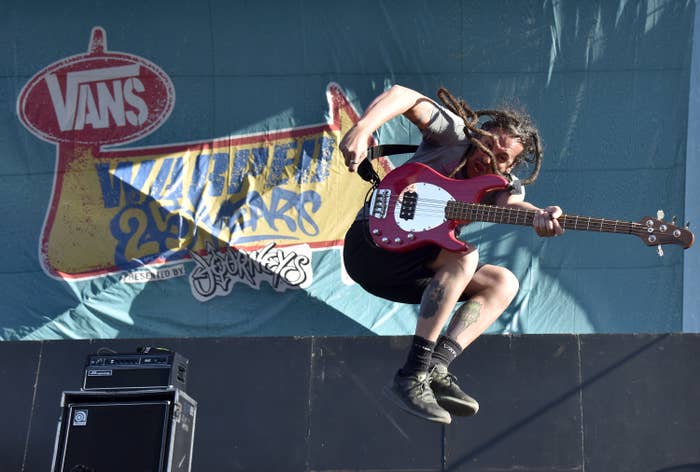 Less Than Jake jumping into the air onstage at the 2019 Vans Warped Tour