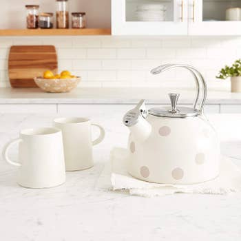 White kettle with light gray polka dots 