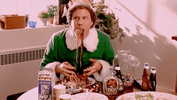 Buddy the Elf eating pasta full of candy 