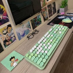 a reviewer photo of their desk set up with the green keyboard and matching mouse 