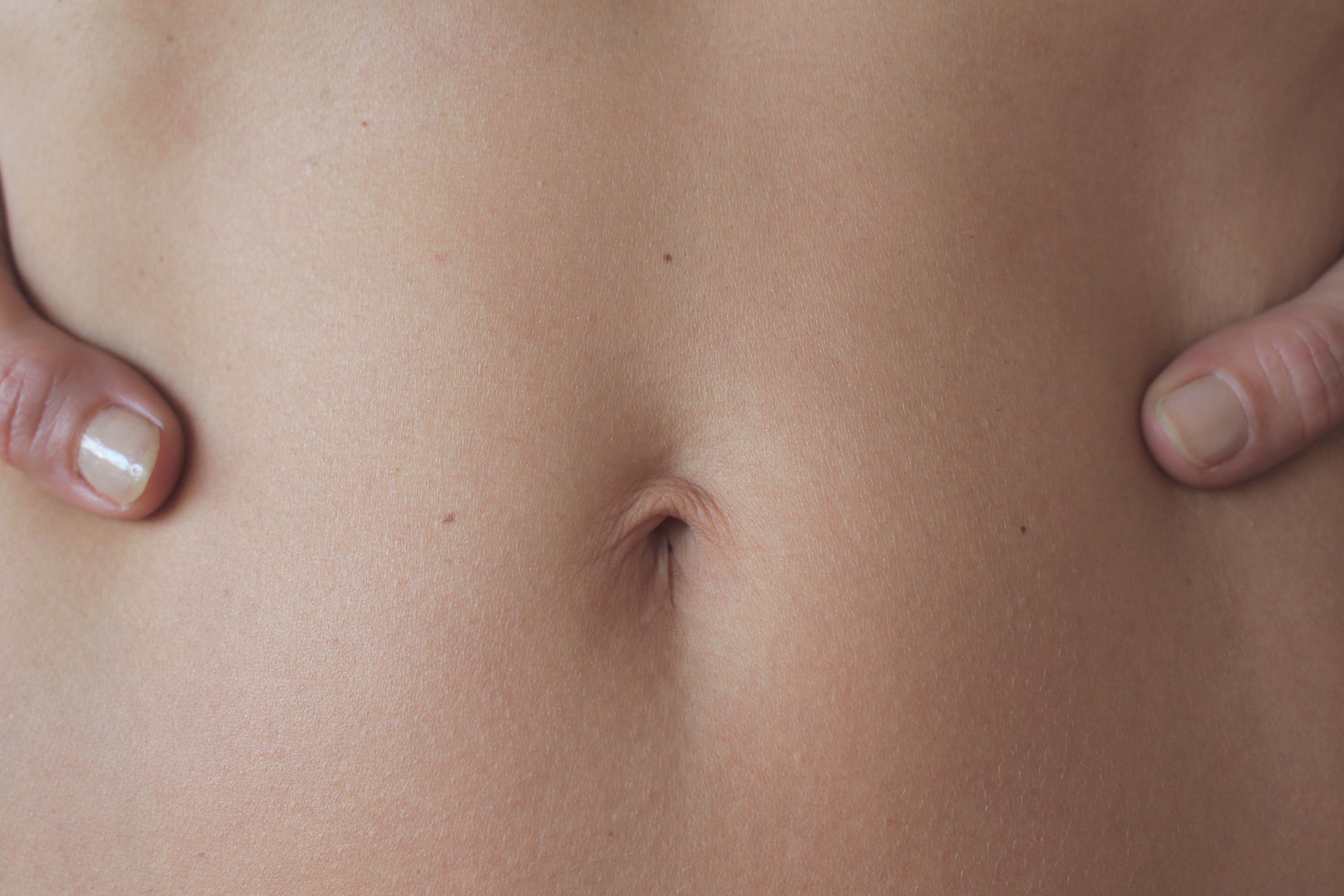close up of a belly button