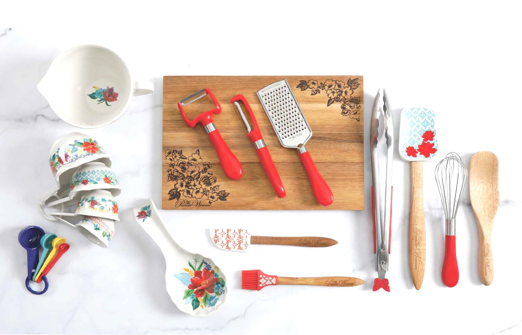 floral utensil set including measuring spoons, spatula, whisk, tongs, peelers, grater, and more
