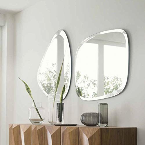 Two frameless mirrors- one shaped like a curved triangle and the other shaped like a curved rectangle.