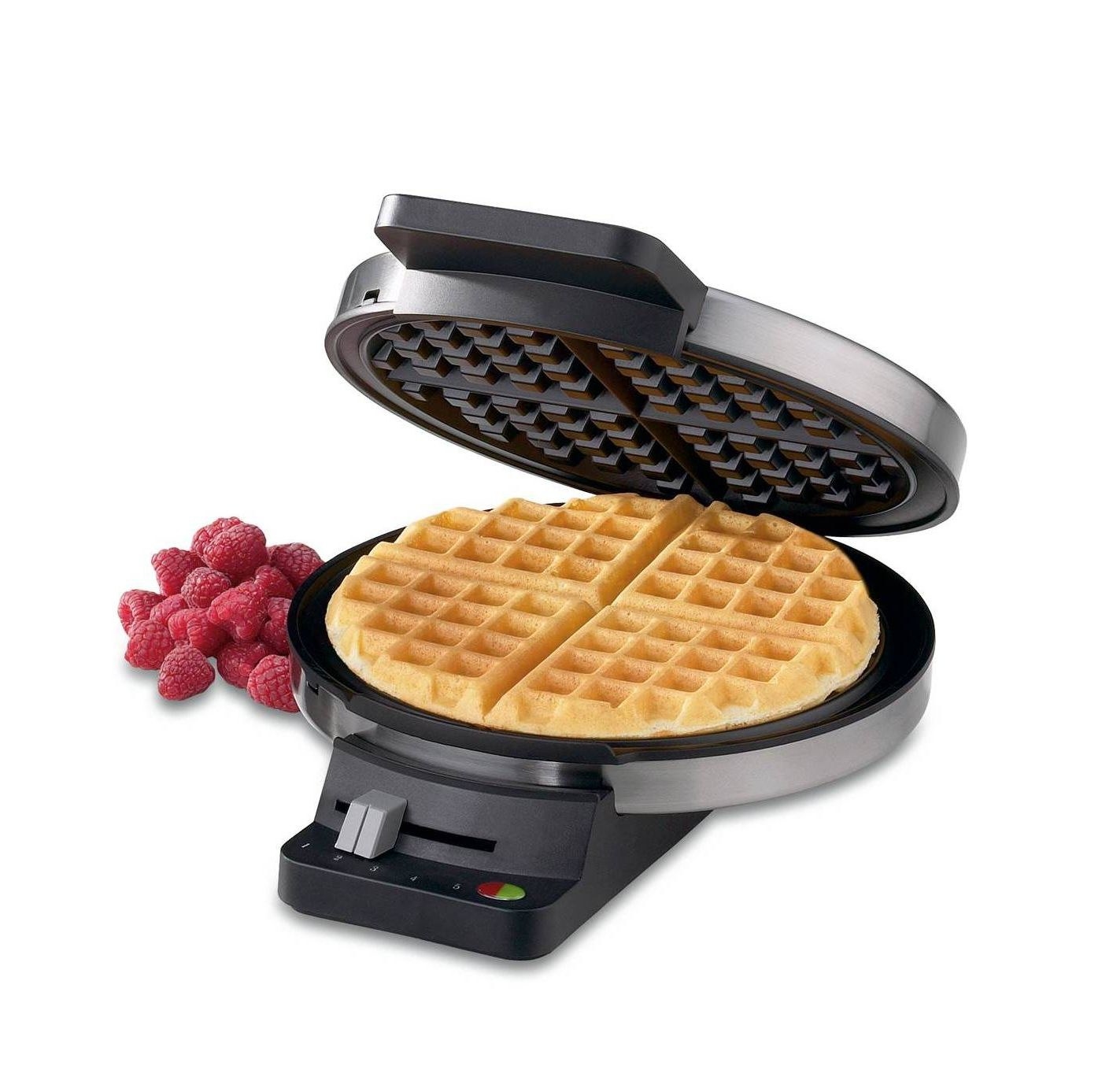 round stainless steel waffle maker with waffle inside