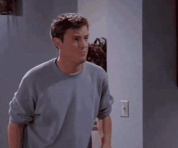 Gif of Chandler from Friends jumping and clapping.