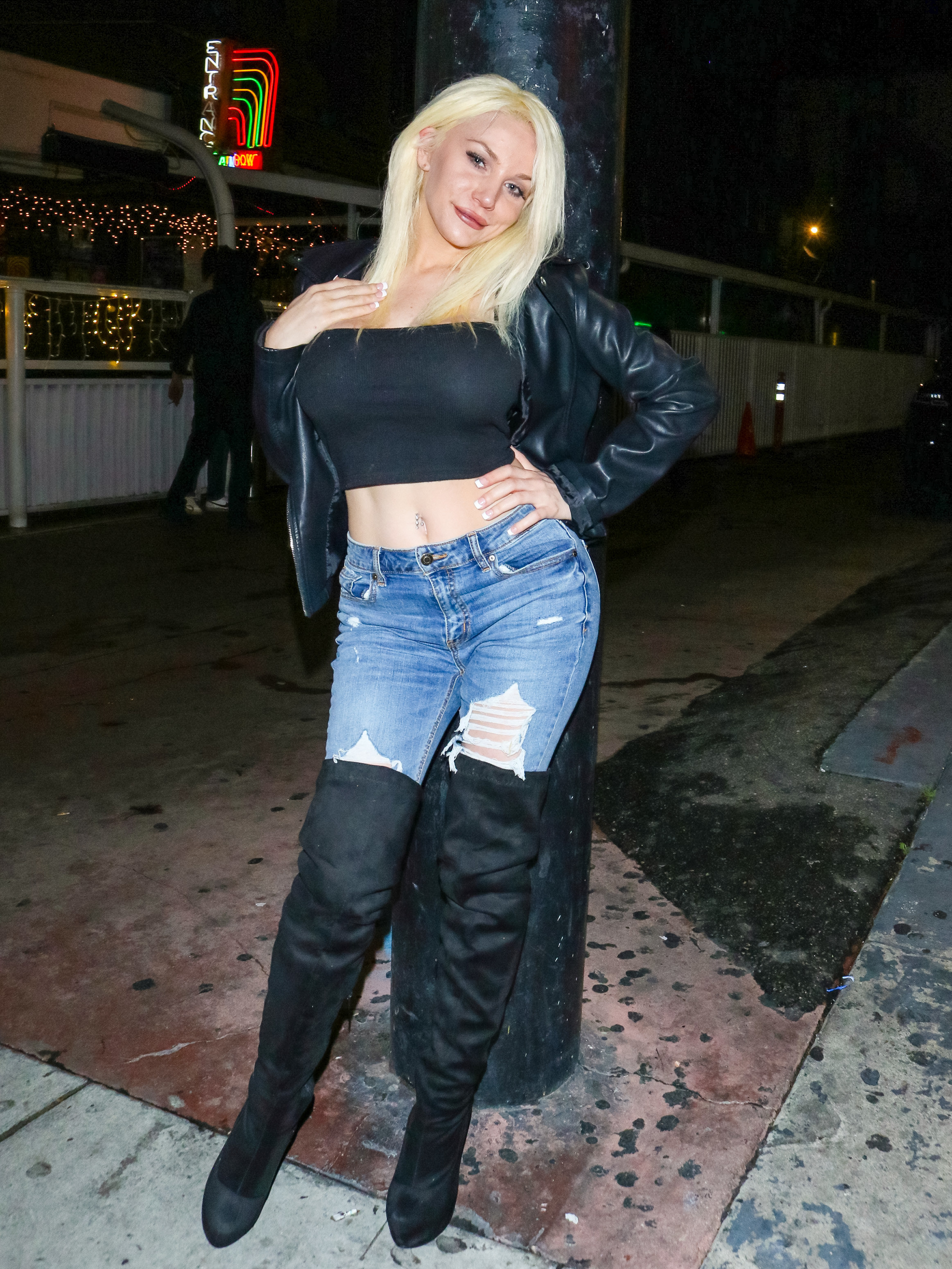 Courtney Stodden wearing thigh-high boots and jeans