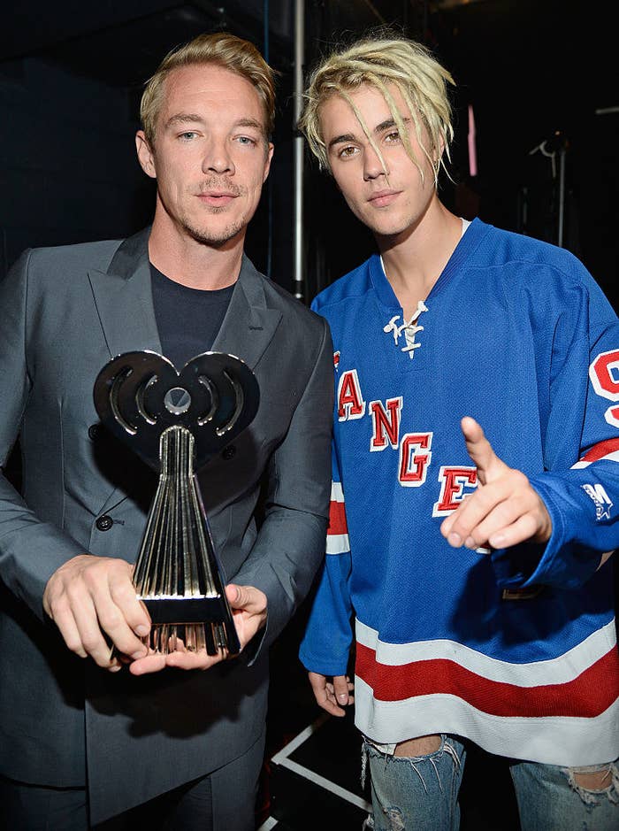 Diplo holding an award and Justin Bieber in a Rangers jersey