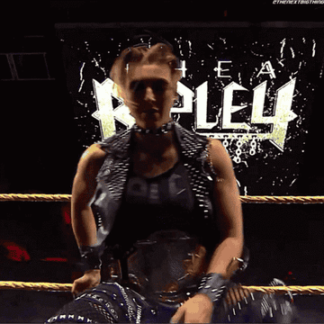 Rhea Ripley poses with NXT Women&#x27;s Championship