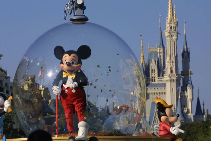 Mickey Mouse in a life-size snow globe at a Disney theme park