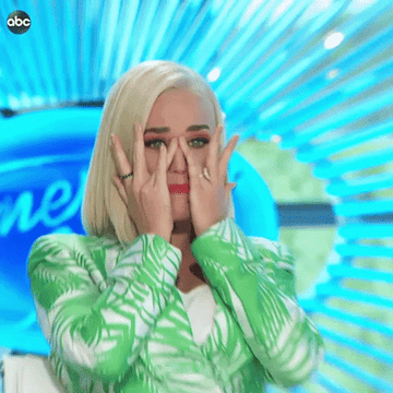Katy Perry attempts to dry her eyes with her fingers on set of &quot;American Idol&quot;