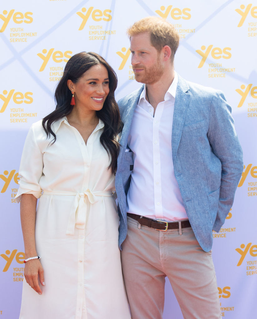 Meghan Markle (L) and Prince Harry visit the Tembisa Township to learn about Youth Employment Services