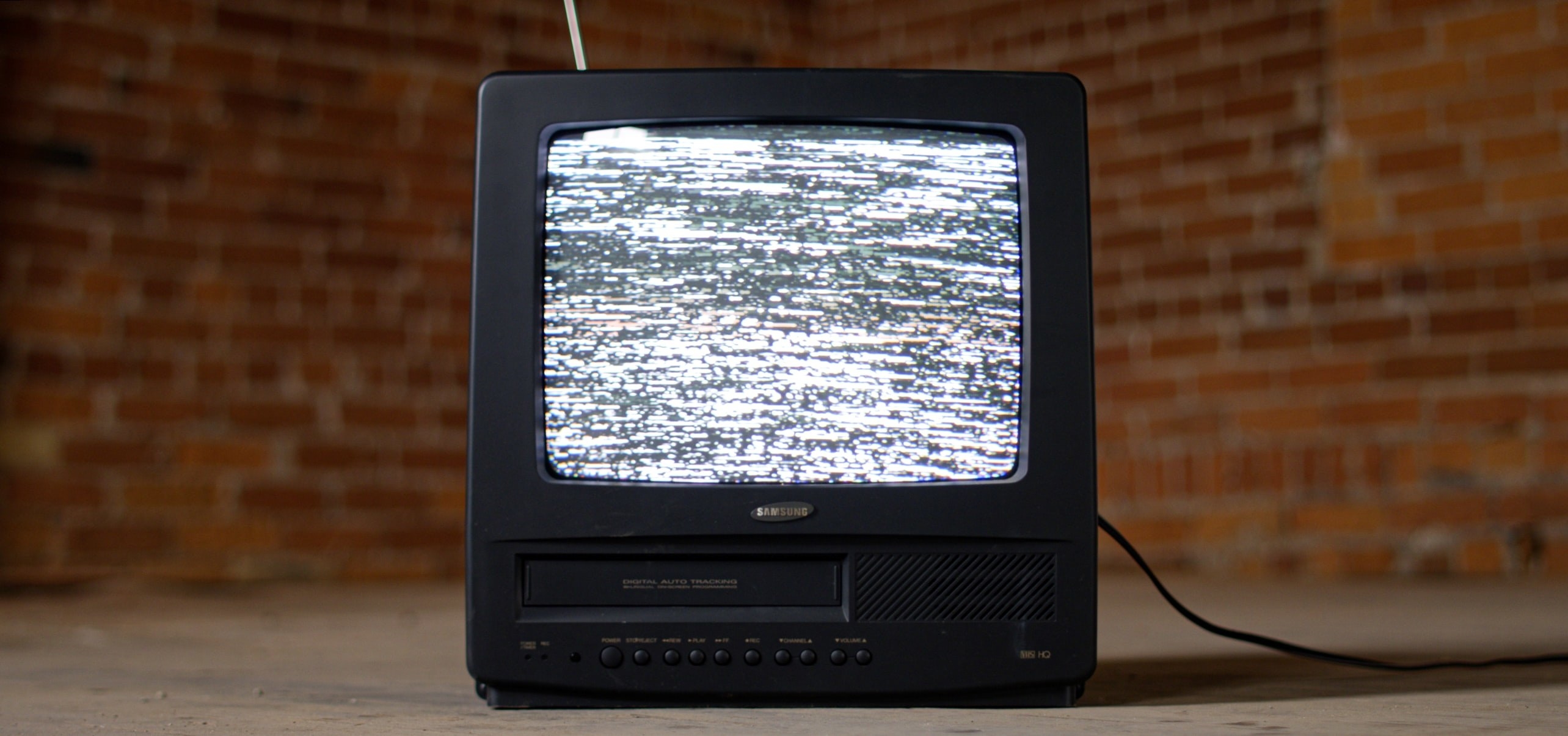 An old-style VCR antenna TV with static on the screen. 