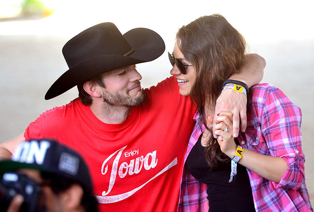 Ashton Kutcher (L) and Mila Kunis attend day 1 of 2014 Stagecoach: California&#x27;s Country Music Festival