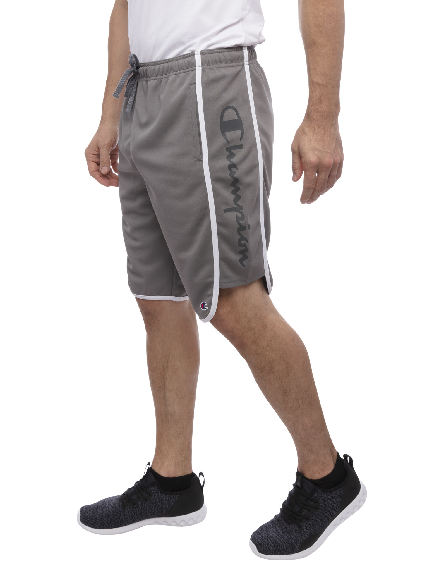 model wearing the grey shorts with black shoes