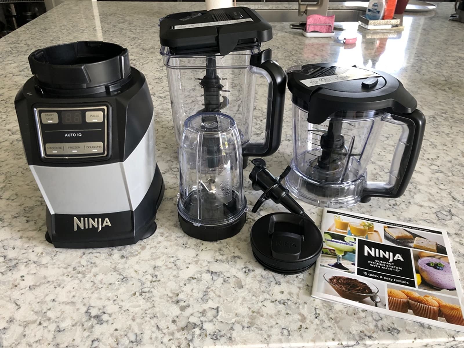 reviewer photo of the blender and all the cups and attachments it comes with