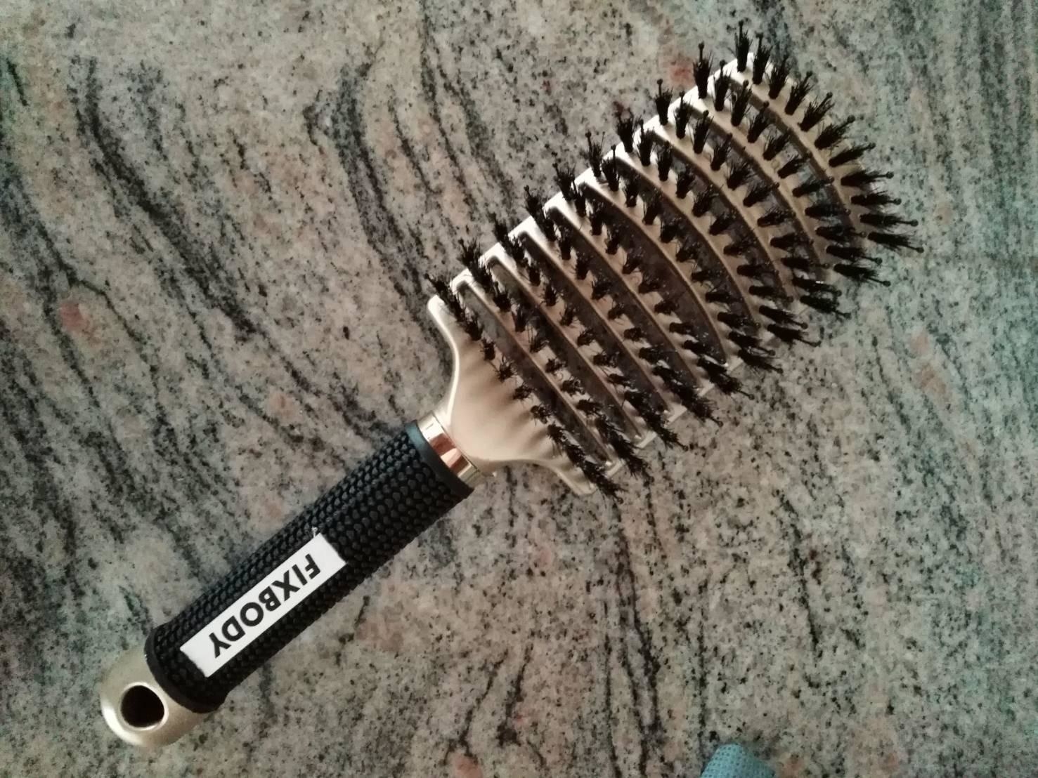 reviewer&#x27;s hair brush in gold