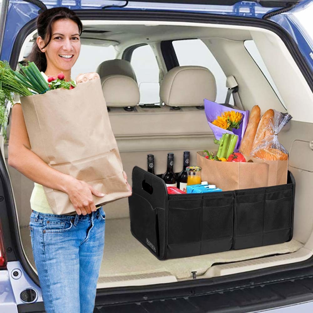 Collapsable car trunk organiser used to hold grocery items