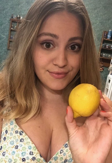 Woman holding a lemon