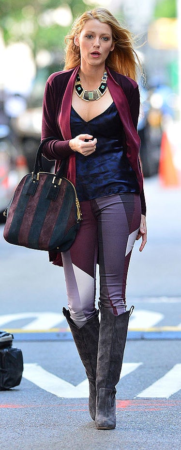 long loose open cardigan with geometric pattern skinny jeans and long knee-length suede boots and a velvet tank and chunky geometric necklace