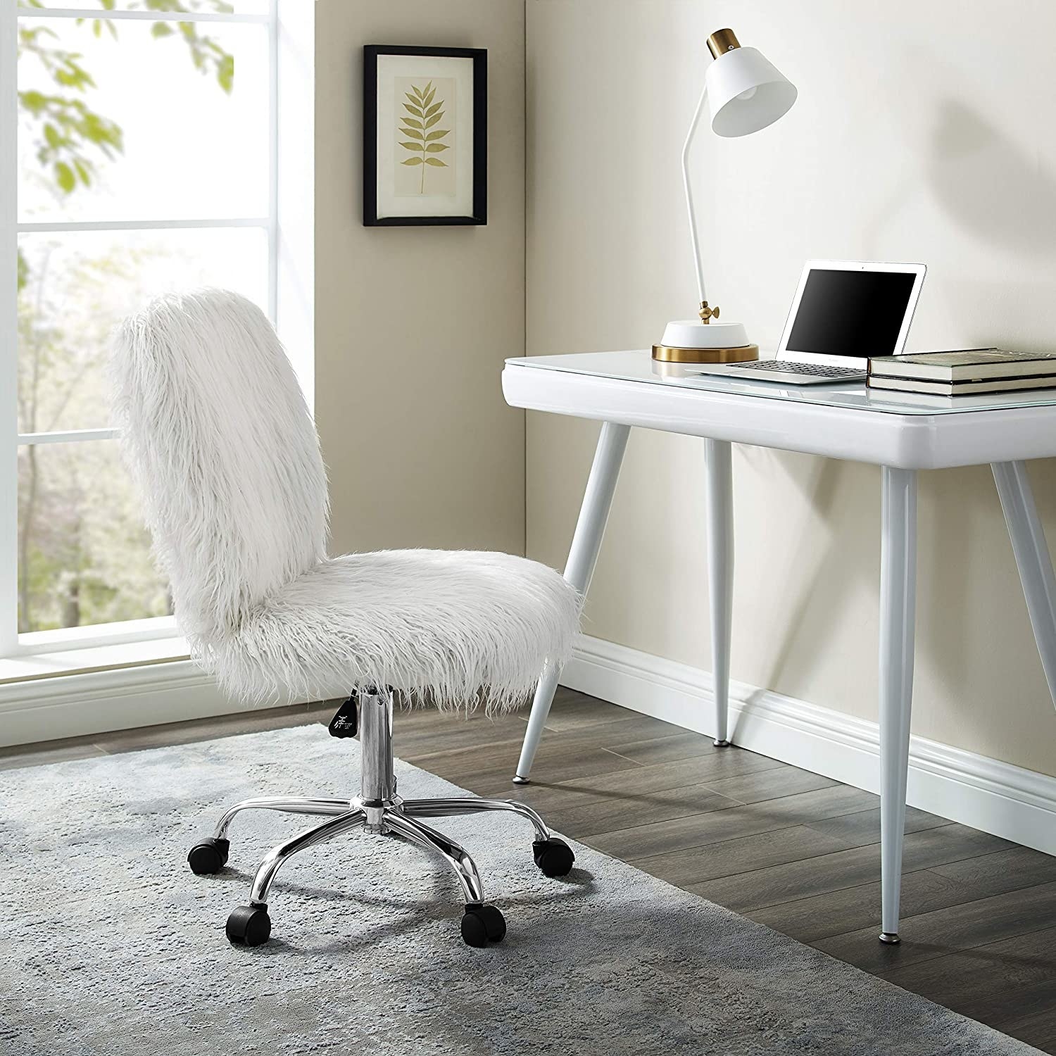 White faux fur desk chair in front of white desk