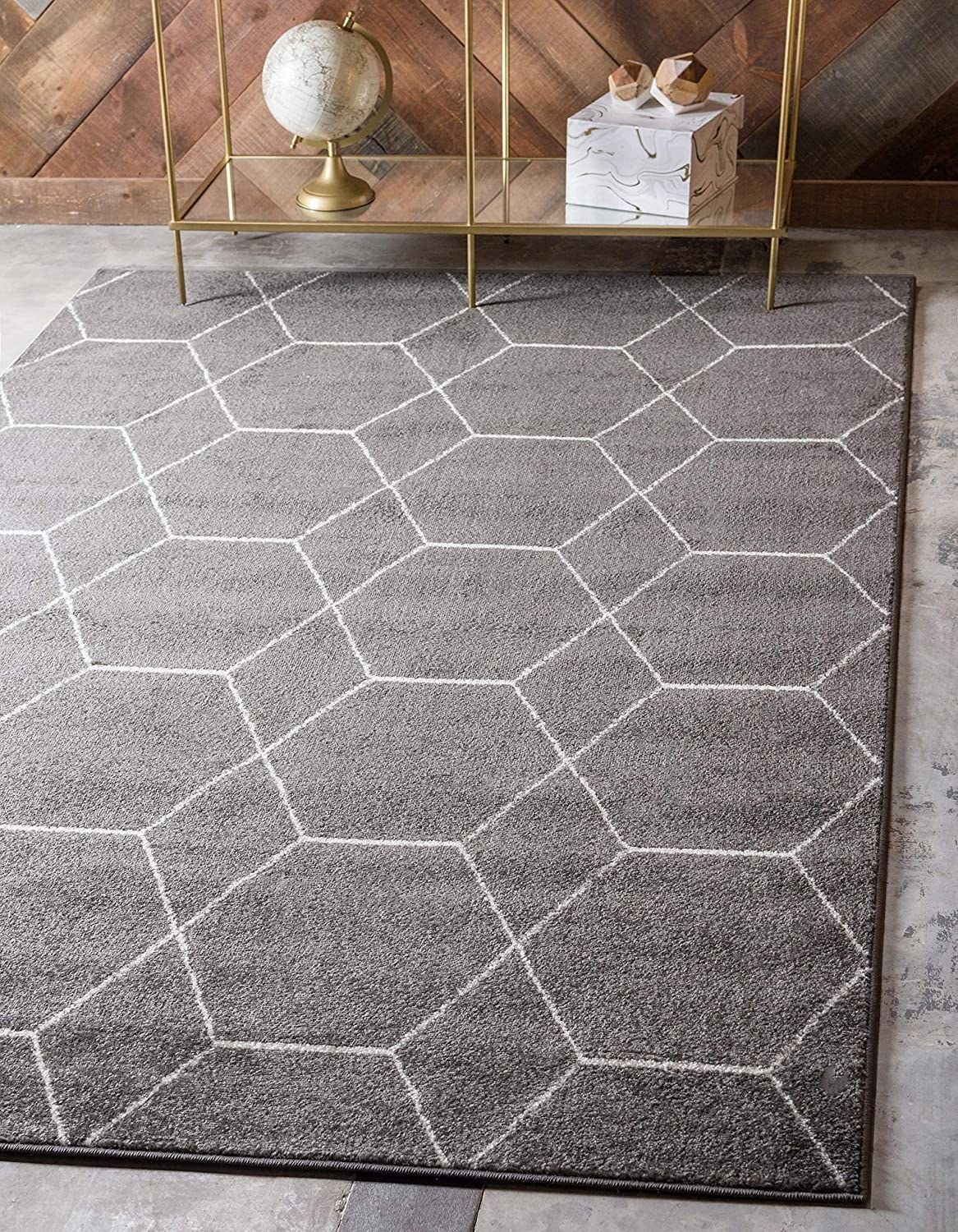 gray area rug with line pattern on it