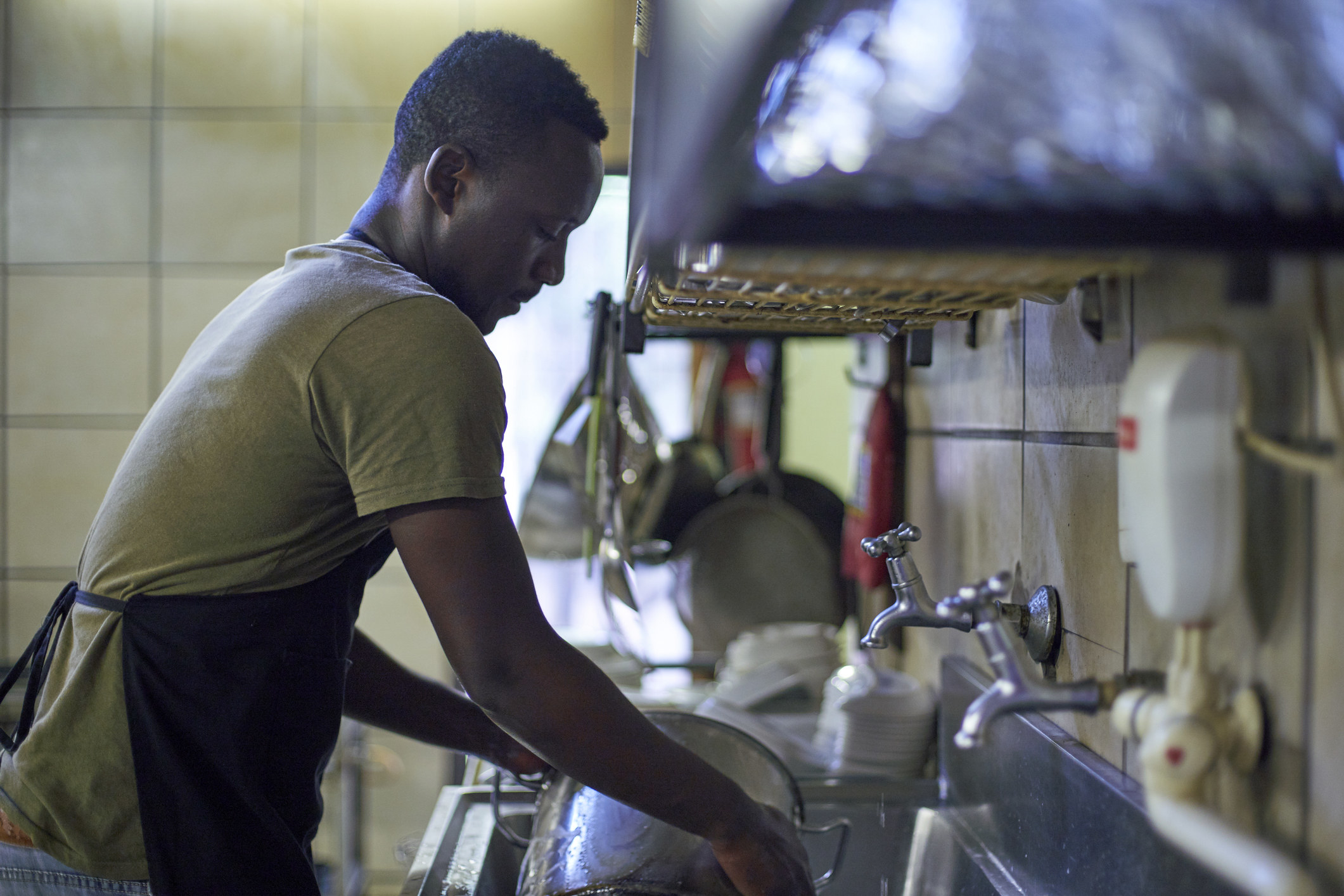 a person washing dishes