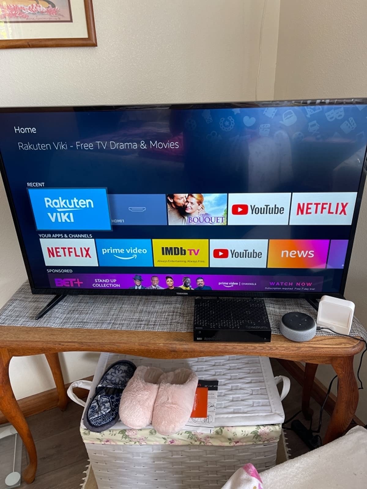 reviewer photo of the TV on a TV stand displaying the Rakuten Viki home page