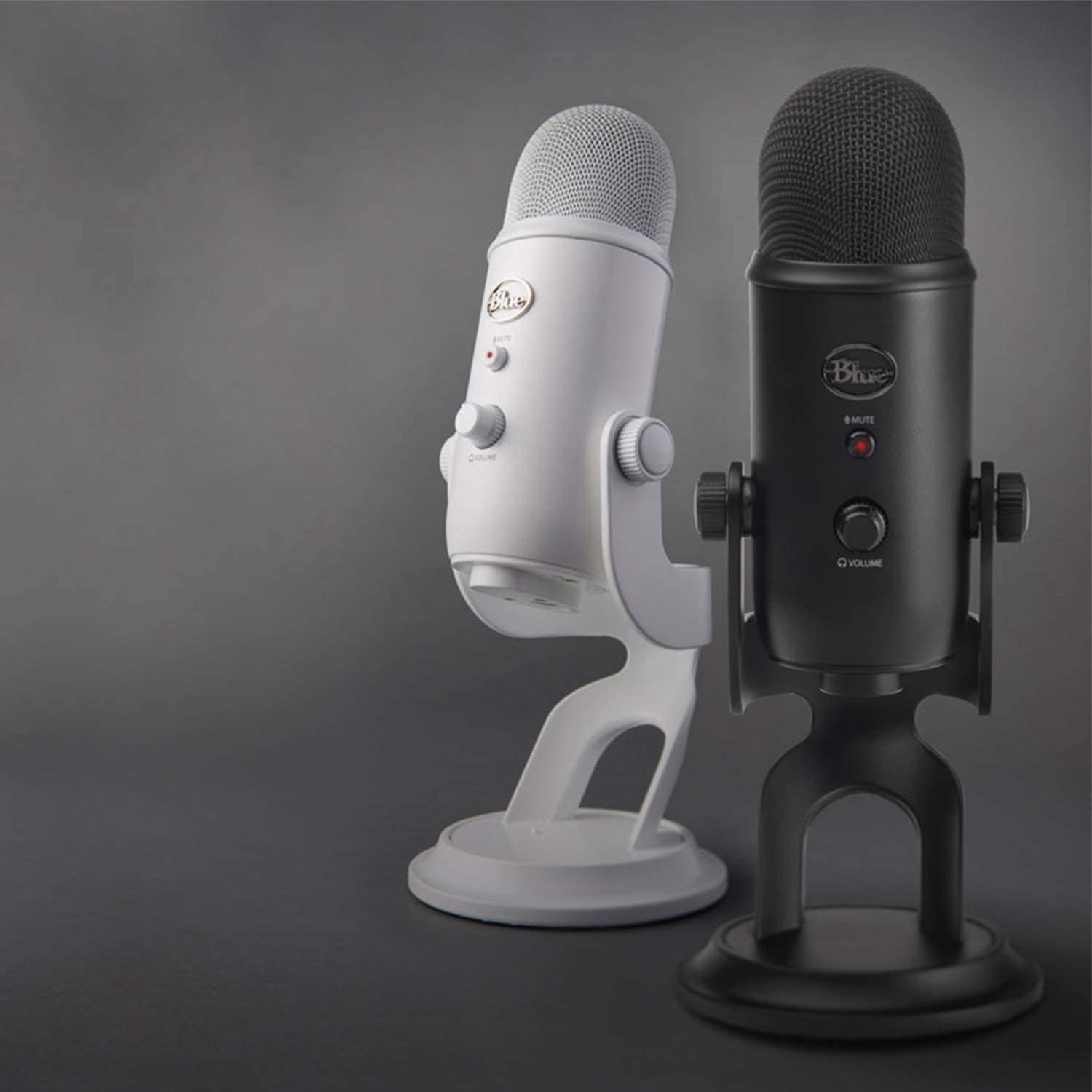 Two stand up mics in white and black
