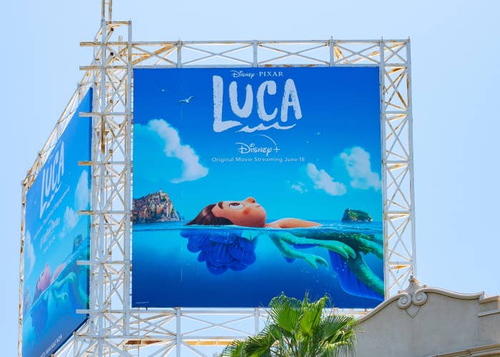 An poster for the film that features a boy floating in the ocean